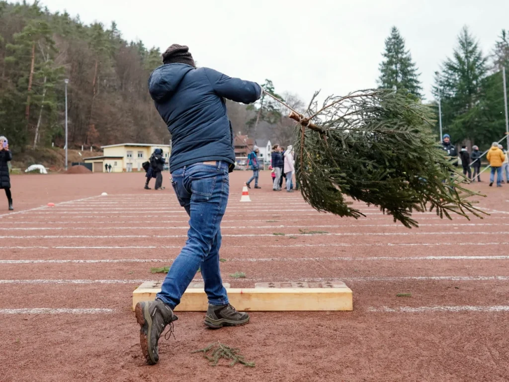 A woman lost her $823,000 injury claim after lawyers found a photo of her winning a Christmas tree-throwing competition